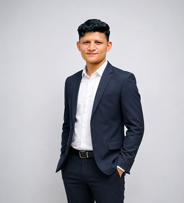 Kamran, SEO and Outreach Specialist at Raza Digitals, wearing a professional business suit and posing for a corporate team profile photo.